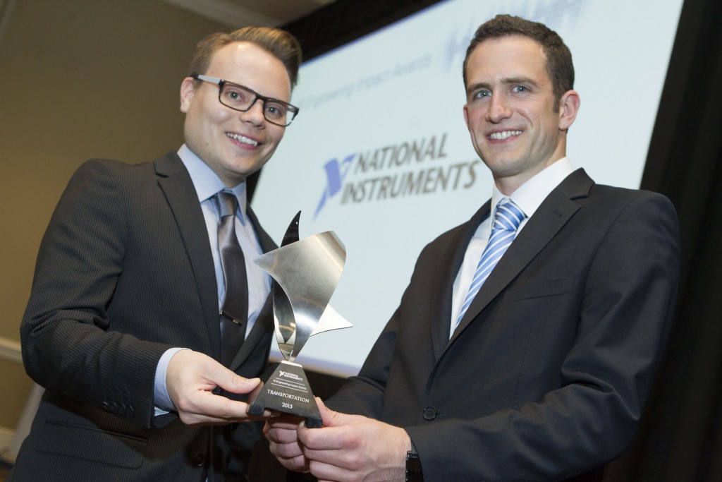 Balazs Pal and Toby Schulz receive the NI week Engineering Impact Award